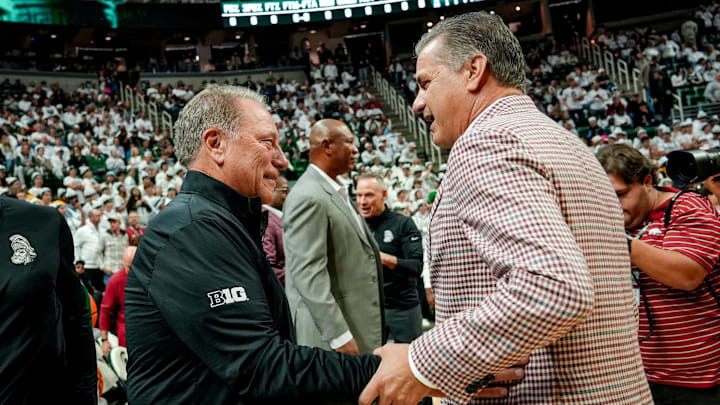 Michigan State's coach Tom Izzo, left, and Arkansas' head coach John Calipari meet before the game on Saturday, Nov. 8, 2025, at the Breslin Center in East Lansing.