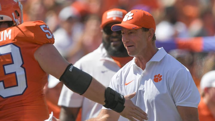 Sep 21, 2024; Clemson, South Carolina, USA; Clemson Tigers head coach Dabo Swinney greets offensive lineman Ryan Linthicum (53) after a score against the North Carolina State Wolfpack during the first quarter at Memorial Stadium.