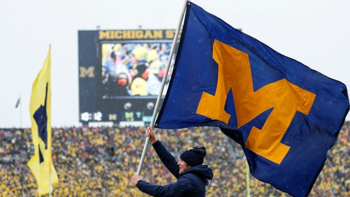 Michigan spirit squad celebrates a touchdown against Ohio State during the first half at Michigan Stadium in Ann Arbor on Saturday, Nov. 27, 2021.

michigan football stock u-m logo, Michigan flag, Michigan banner