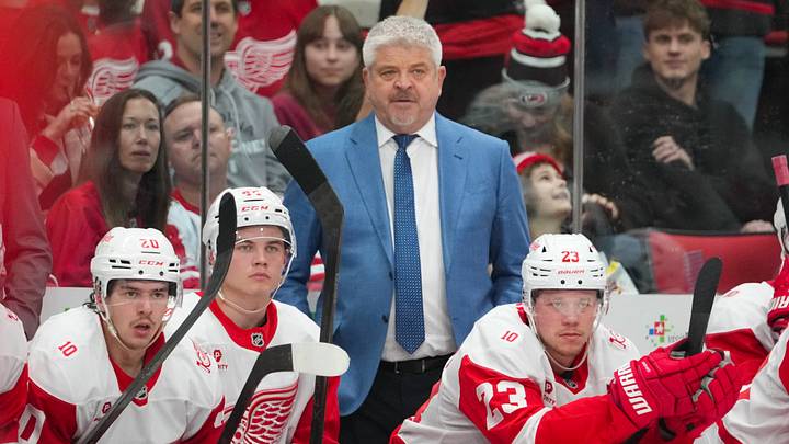 Feb 28, 2026; Raleigh, North Carolina, USA; Detroit Red Wings head coach Todd McLellan looks on against the Carolina Hurricanes during the third period at Lenovo Center. Mandatory Credit: James Guillory-Imagn Images Feb 28, 2026; Raleigh, North Carolina, USA; Detroit Red Wings head coach Todd McLellan looks on against the Carolina Hurricanes during the third period at Lenovo Center. Mandatory Credit: James Guillory-Imagn Images