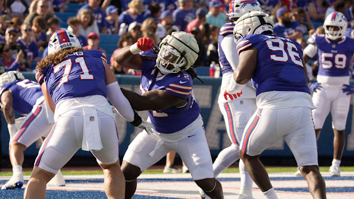 Buffalo Bills defensive tackle Marcus Harris pushes works on getting by defensive tackle Casey Rogers and defensive tackle Deone Walker during the Return of the Blue & Red practice at Highmark Stadium in Orchard Park on Aug.1, 2025.