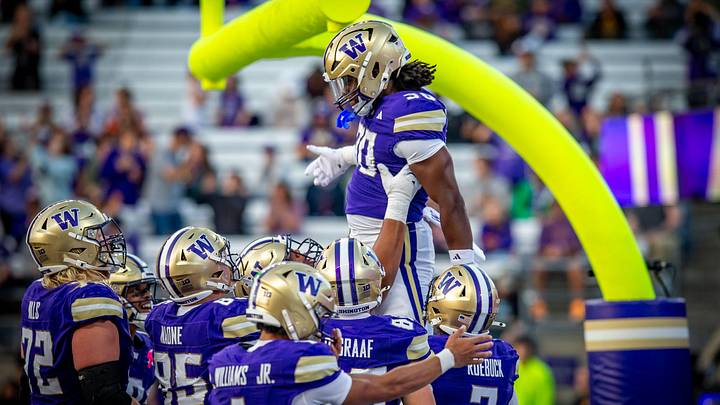 Ansu Sanoe gets lifted up by his UW teammates after scoring against Eastern. Ansu Sanoe gets lifted up by his UW teammates after scoring against Eastern.