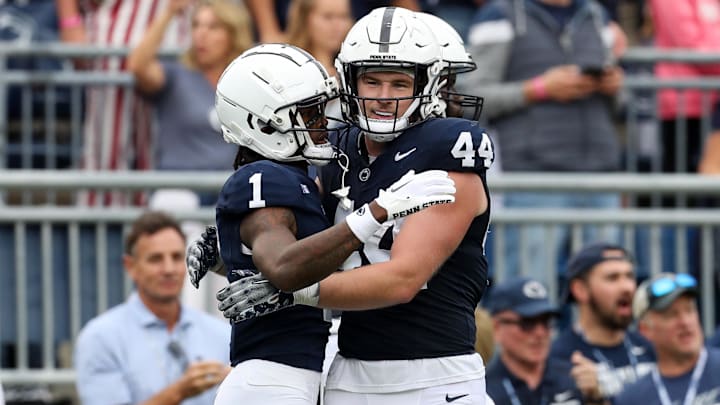 Oct 28, 2023; University Park, Pennsylvania, USA; Penn State Nittany Lions wide receiver KeAndre Lambert-Smith (1) is congratulated by tight end Tyler Warren (44) after scoring a touchdown during the fourth quarter against the Indiana Hoosiers at Beaver Stadium. Penn State defeated Indiana 33-24. Mandatory Credit: Matthew O'Haren-Imagn Images
