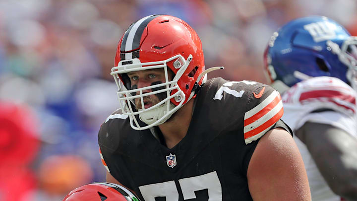 Cleveland Browns guard Wyatt Teller (77) helps up quarterback Deshaun Watson (4) during the first half of an NFL football game against the New York Giants at Huntington Bank Field, Sunday, Sept. 22, 2024, in Cleveland, Ohio. Cleveland Browns guard Wyatt Teller (77) helps up quarterback Deshaun Watson (4) during the first half of an NFL football game against the New York Giants at Huntington Bank Field, Sunday, Sept. 22, 2024, in Cleveland, Ohio.