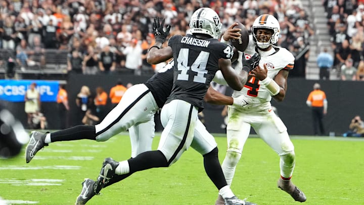 Sep 29, 2024; Paradise, Nevada, USA; Las Vegas Raiders defensive end Charles Snowden (49) and defensive end K'Lavon Chaisson (44) stop Cleveland Browns quarterback Deshaun Watson (4) in the fourth quarter at Allegiant Stadium. Mandatory Credit: Stephen R. Sylvanie-Imagn Images
