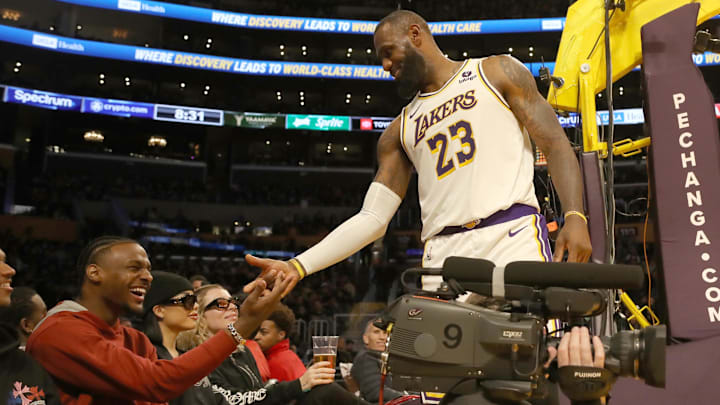 Nov 19, 2023; Los Angeles, California, USA; Los Angeles Lakers forward LeBron James (23) shakes hands with his son Bronny James during the second half against the Houston Rockets at Crypto.com Arena. Mandatory Credit: Kiyoshi Mio-Imagn Images Nov 19, 2023; Los Angeles, California, USA; Los Angeles Lakers forward LeBron James (23) shakes hands with his son Bronny James during the second half against the Houston Rockets at Crypto.com Arena. Mandatory Credit: Kiyoshi Mio-Imagn Images
