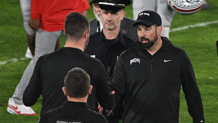 Jan 1, 2025; Pasadena, CA, USA; Ohio State Buckeyes head coach Ryan Day (right) shakes hands with Oregon Ducks head coach Dan Lanning at the conclusion of the Rose Bowl game at Rose Bowl Stadium. Mandatory Credit: Robert Hanashiro-Imagn Images Jan 1, 2025; Pasadena, CA, USA; Ohio State Buckeyes head coach Ryan Day (right) shakes hands with Oregon Ducks head coach Dan Lanning at the conclusion of the Rose Bowl game at Rose Bowl Stadium. Mandatory Credit: Robert Hanashiro-Imagn Images
