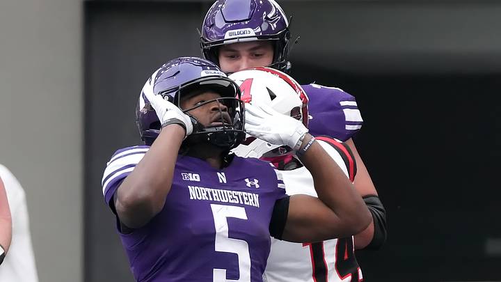 Oct 10, 2026; Evanston, Illinois, USA; Northwestern Wildcats running back Caleb Komolafe (5) celebrates his touchdown against the Ball State Cardinals during the first half at New Ryan Field. Mandatory Credit: David Banks-Imagn Images Oct 10, 2026; Evanston, Illinois, USA; Northwestern Wildcats running back Caleb Komolafe (5) celebrates his touchdown against the Ball State Cardinals during the first half at New Ryan Field. Mandatory Credit: David Banks-Imagn Images