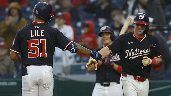 Jun 16, 2025; Washington, District of Columbia, USA; Washington Nationals outfielder Daylen Lile (51) celebrates with Washington Nationals outfielder Jacob Young (30) after hitting a solo home run against the Colorado Rockies during the fifth inning at Nationals Park.
