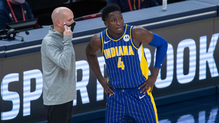 Jan 9, 2021; Indianapolis, Indiana, USA; Indiana Pacers head coach Nate Bjorkgren talks with guard Victor Oladipo (4) during a free throw in the fourth quarter against the Phoenix Suns at Bankers Life Fieldhouse. Mandatory Credit: Trevor Ruszkowski-Imagn Images