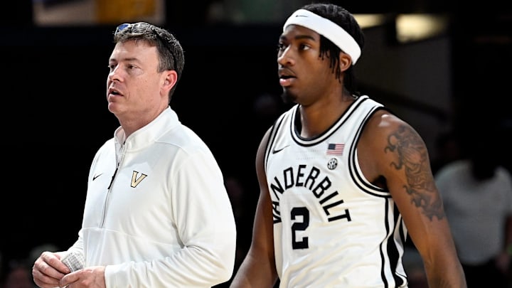 Vanderbilt basketball head coach Mark Byington talks with guard M.J. Collins Jr. (2) during an NCAA college basketball game against California Wednesday, Nov. 13, 2024, in Nashville, Tenn.