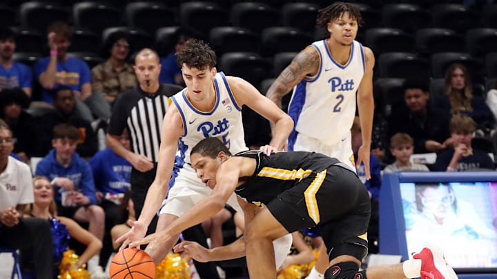 Nov 18, 2024; Pittsburgh, Pennsylvania, USA;  Pittsburgh Panthers forward Guillermo Diaz Graham (25) steals the ball from Virginia Military Keydets forward Kaden Stuckey (6) during the first half at the Petersen Events Center. Mandatory Credit: Charles LeClaire-Imagn Images