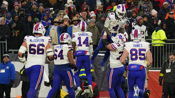 Buffalo Bills running back James Cook III (4) is congratulated after his touchdown against the New England Patriots in the second half at Gillette Stadium.