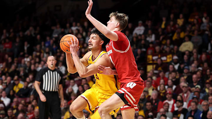 Mar 5, 2025; Minneapolis, Minnesota, USA; Minnesota Golden Gophers forward Dawson Garcia (3) works around Wisconsin Badgers forward Nolan Winter (31) during the first half at Williams Arena. Mandatory Credit: Matt Krohn-Imagn Images