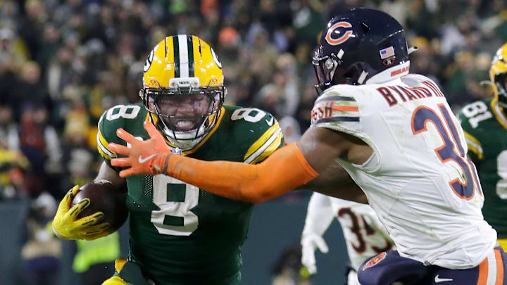 Green Bay's  Josh Jacobs attempts to break a tackle attempt by Kevin Byard in the Bears' 28-21 loss at Lambeau Field.