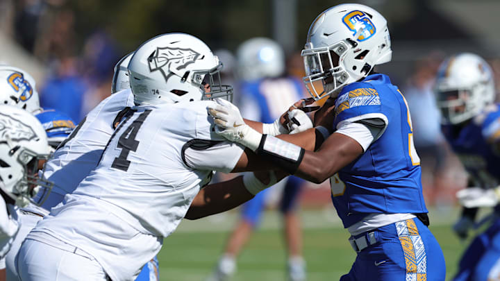 Bosco offensive lineman Adrian Tavui (left) squares off with Serra's Quinn Seeberan during a Sept. 14 tussle. Both teams are near the top of their respective sections, Bosco (Southern) and Serra (Central Coast)