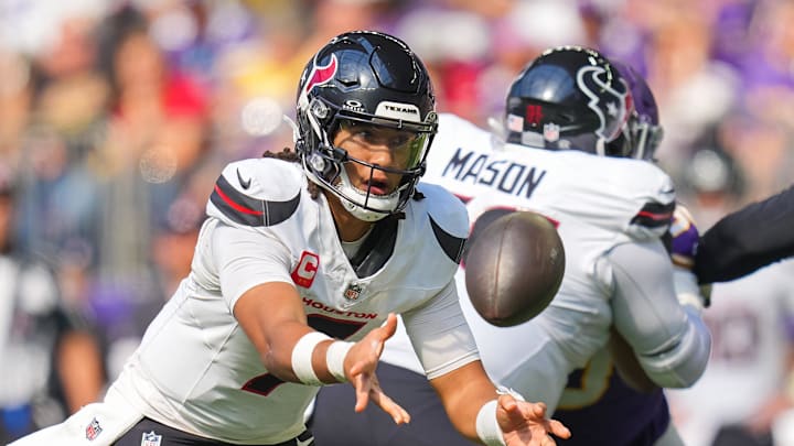 Sep 22, 2024; Minneapolis, Minnesota, USA; Houston Texans quarterback C.J. Stroud (7) pitches the ball against the Minnesota Vikings in the third quarter at U.S. Bank Stadium. Mandatory Credit: Brad Rempel-Imagn Images