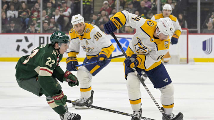 Jan 25, 2024; Saint Paul, Minnesota, USA; Minnesota Wild forward Marco Rossi (23) poke-checks the