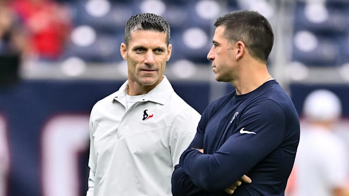Sep 17, 2023; Houston, Texas, USA; Houston Texans general manager Nick Caserio (left) speaks with special teams coordinator Frank Ross (right) prior to the game against the Indianapolis Colts at NRG Stadium. Mandatory Credit: Maria Lysaker-Imagn Images