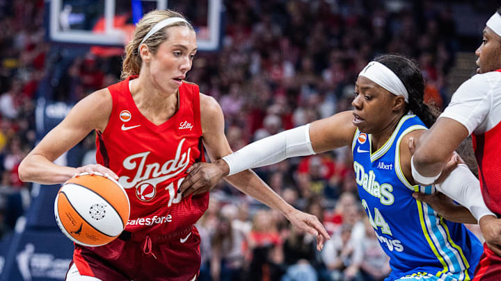 May 9, 2026; Indianapolis, Indiana, USA; Indiana Fever guard Lexie Hull (10) dribbles the ball while Dallas Wings guard Arike Ogunbowale (24) defends in the first half at Gainbridge Fieldhouse. Mandatory Credit: Trevor Ruszkowski-Imagn Images