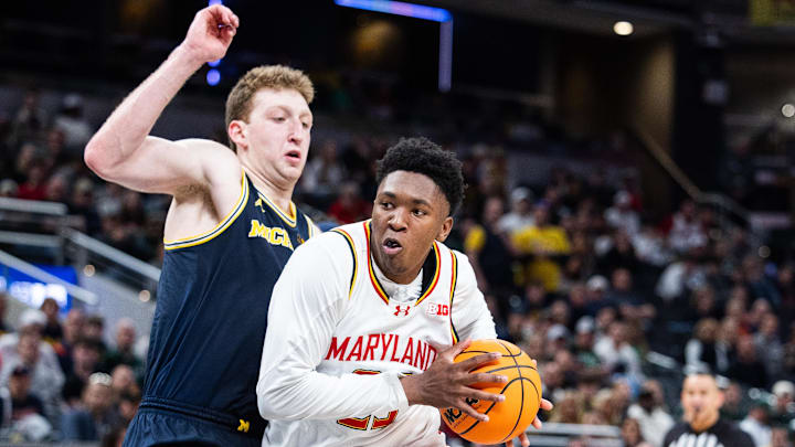 Mar 15, 2025; Indianapolis, IN, USA; Maryland Terrapins center Derik Queen (25) dribbles the ball while Michigan Wolverines center Danny Wolf (1)