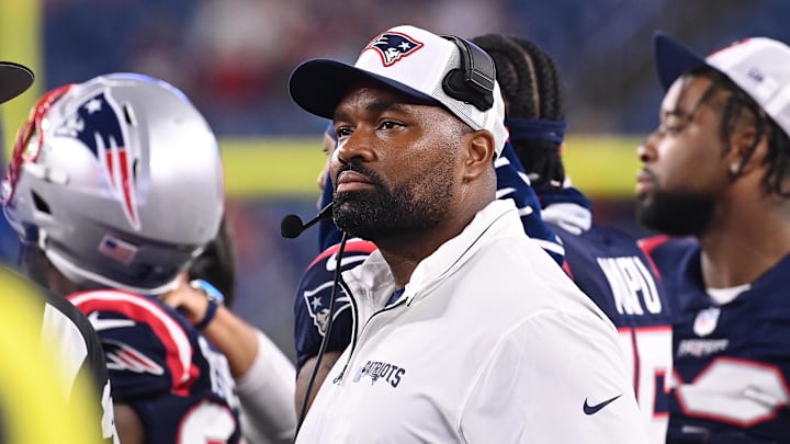 August 8, 2024; Foxborough, MA, USA;  New England Patriots head coach Jerod Mayo watches the video boards after challenging a call on the field during the second half against the Carolina Panthers at Gillette Stadium. Mandatory Credit: Eric Canha-USA TODAY Sports
