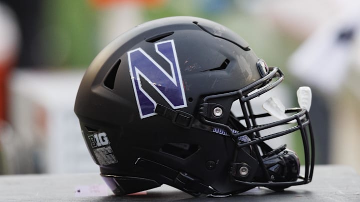Nov 11, 2023; Madison, Wisconsin, USA;  General view of a Northwestern Wildcats helmet on the sidelines during the game against the Wisconsin Badgers at Camp Randall Stadium. Mandatory Credit: Jeff Hanisch-Imagn Images