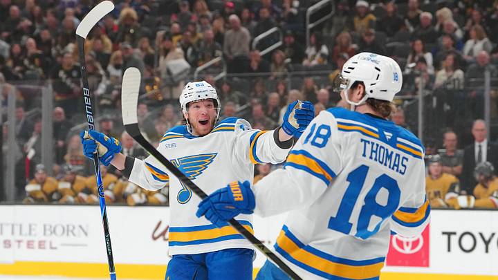 Jan 10, 2026; Las Vegas, Nevada, USA; St. Louis Blues left wing Jake Neighbours (63) celebrates a goal scored against the Vegas Golden Knights by center Robert Thomas (18) during the first period at T-Mobile Arena. Mandatory Credit: Stephen R. Sylvanie-Imagn Images Jan 10, 2026; Las Vegas, Nevada, USA; St. Louis Blues left wing Jake Neighbours (63) celebrates a goal scored against the Vegas Golden Knights by center Robert Thomas (18) during the first period at T-Mobile Arena. Mandatory Credit: Stephen R. Sylvanie-Imagn Images
