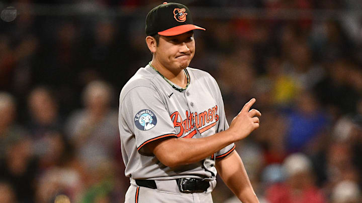 Former Baltimore Orioles starting pitcher Tomoyuki Sugano (19) reacts after being called for a balk. 