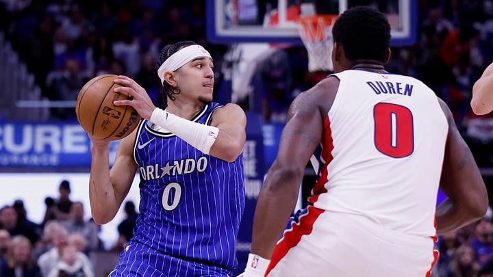 May 3, 2026; Detroit, Michigan, USA; Orlando Magic guard Anthony Black (0) dribbles defended by Detroit Pistons center Jalen Duren (0) in the first half during game seven of the first round of the 2026 NBA Playoffs at Little Caesars Arena. Mandatory Credit: Rick Osentoski-Imagn Images