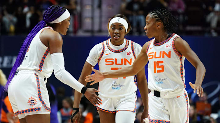 Connecticut Sun forward Aneesah Morrow (24), forward Aaliyah Edwards (8) and guard Lindsay Allen (15) react after a play against the Phoenix Mercury in the second half at Mohegan Sun Arena. 