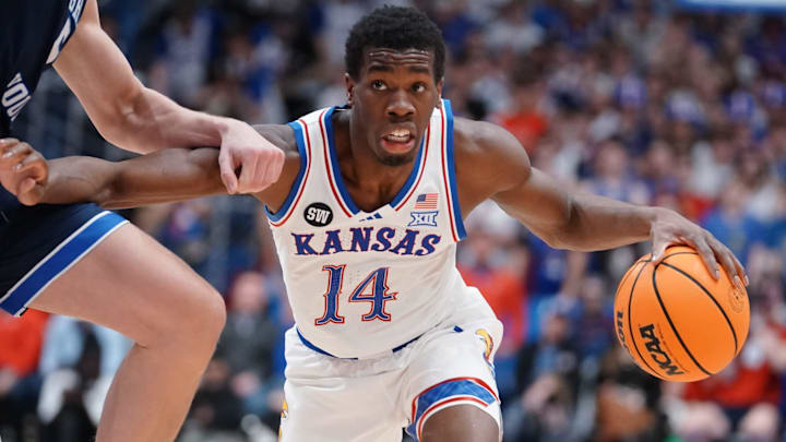 Kansas Jayhawks guard Melvin Council Jr. (14) drives the ball against BYU Cougars during the game inside Allen Fieldhouse on Jan. 31, 2026.