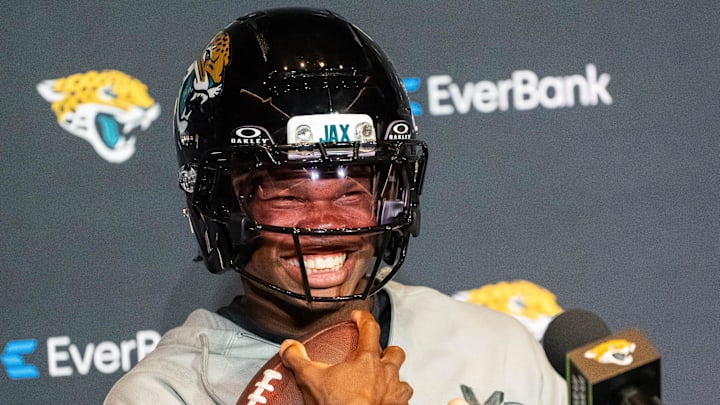 The Jacksonville Jaguars’ first-round pick, Colorado Buffaloes wide receiver and defensive back Travis Hunter sits in his chair with his helmet on and acting as if he was running after answering questions during a press conference Friday, March 25, 2025 at Miller Electric Center in Jacksonville, Fla. [Doug Engle/Florida Times-Union]