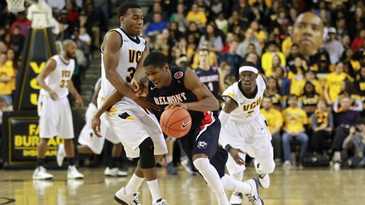 December 1, 2012; Richmond, VA USA; Belmont Bruins guard Kerron Johnson (3) dribbles the ball as Virginia Commonwealth Rams guard Melvin Johnson (32) and Rams guard Briante Weber (2) defend in the first half at the Stuart C. Siegel Center. The Rams won 75-65. 