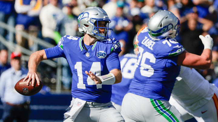 Oct 5, 2025; Seattle, Washington, USA; Seattle Seahawks quarterback Sam Darnold (14) stands in the pocket against the Tampa Bay Buccaneers during the first half at Lumen Field. Mandatory Credit: Joe Nicholson-Imagn Images