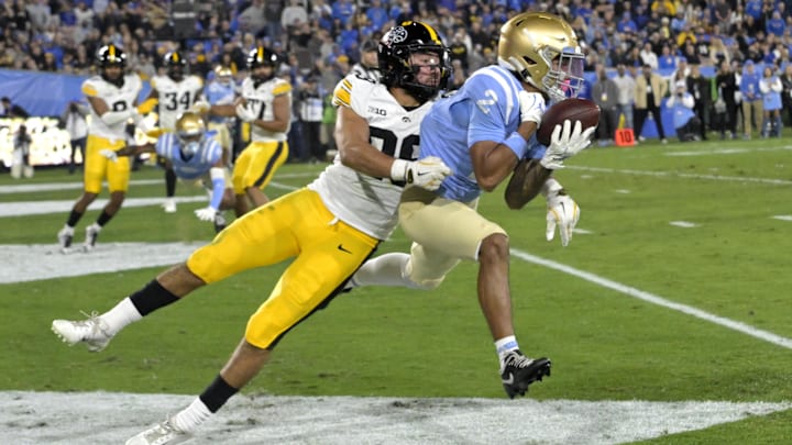 Nov 8, 2024; Pasadena, California, USA; UCLA Bruins running back Anthony Frias II (29) is defended by Iowa Hawkeyes defensive back Sebastian Castro (29) as he makes a catch in the end zone for a touchdown in the first half at the Rose Bowl. Mandatory Credit: Jayne Kamin-Oncea-Imagn Images Nov 8, 2024; Pasadena, California, USA; UCLA Bruins running back Anthony Frias II (29) is defended by Iowa Hawkeyes defensive back Sebastian Castro (29) as he makes a catch in the end zone for a touchdown in the first half at the Rose Bowl. Mandatory Credit: Jayne Kamin-Oncea-Imagn Images