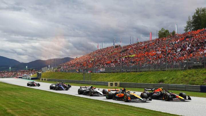 Sergio Perez of Mexico driving the (11) Oracle Red Bull Racing RB19 leads Oscar Piastri of Australia driving the (81) McLaren MCL60 Mercedes and Yuki Tsunoda of Japan driving the (22) Scuderia AlphaTauri AT04 on track during the F1 Grand Prix of Austria at Red Bull Ring on July 02, 2023 in Spielberg, Austria. Sergio Perez of Mexico driving the (11) Oracle Red Bull Racing RB19 leads Oscar Piastri of Australia driving the (81) McLaren MCL60 Mercedes and Yuki Tsunoda of Japan driving the (22) Scuderia AlphaTauri AT04 on track during the F1 Grand Prix of Austria at Red Bull Ring on July 02, 2023 in Spielberg, Austria.