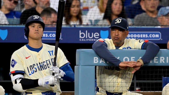 Aug 30, 2025; Los Angeles, California, USA;  Los Angeles Dodgers designated hitter Shohei Ohtani (17) and manager Dave Roberts (30) look on from the dugout during the fifth inning against the Arizona Diamondbacks at Dodger Stadium. Mandatory Credit: Jayne Kamin-Oncea-Imagn Images