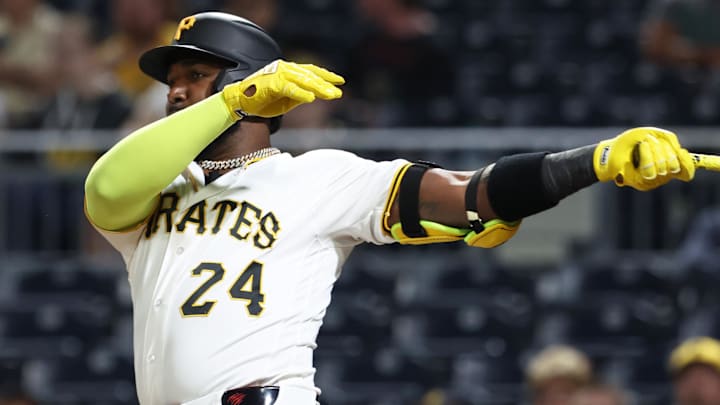Apr 14, 2026; Pittsburgh, Pennsylvania, USA; Pittsburgh Pirates designated hitter Marcell Ozuna (24) hits an RBI double against the Washington Nationals during the fourth inning at PNC Park. Mandatory Credit: Charles LeClaire-Imagn Images
