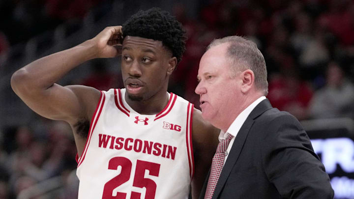 Wisconsin head coach Greg Gard talks with guard John Blackwell (25) during the second half of their game Friday, December 19, 2025 at Fiserv Forum in Milwaukee, Wisconsin. Villanova beat Wisconsin 76-66 in overtime. Wisconsin head coach Greg Gard talks with guard John Blackwell (25) during the second half of their game Friday, December 19, 2025 at Fiserv Forum in Milwaukee, Wisconsin. Villanova beat Wisconsin 76-66 in overtime.