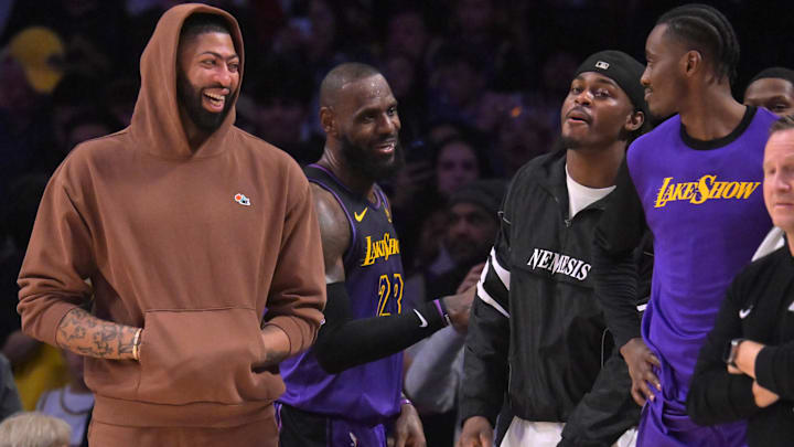 Jan 2, 2025; Los Angeles, California, USA;   Los Angeles Lakers forward Anthony Davis (3), forward LeBron James (23), forward Jarred Vanderbilt (2) and center Christian Koloko (10) on the bench in the fourth quarter against the Portland Trail Blazers at Crypto.com Arena. Mandatory Credit: Jayne Kamin-Oncea-Imagn Images