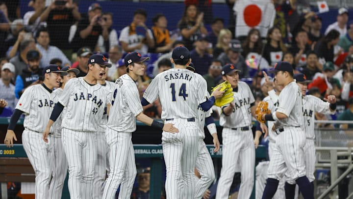 Mar 20, 2023; Miami, Florida, USA; Japan starting pitcher Roki Sasaki (14) celebrates with teammates after the first inning against Mexico at LoanDepot Park. Mar 20, 2023; Miami, Florida, USA; Japan starting pitcher Roki Sasaki (14) celebrates with teammates after the first inning against Mexico at LoanDepot Park.