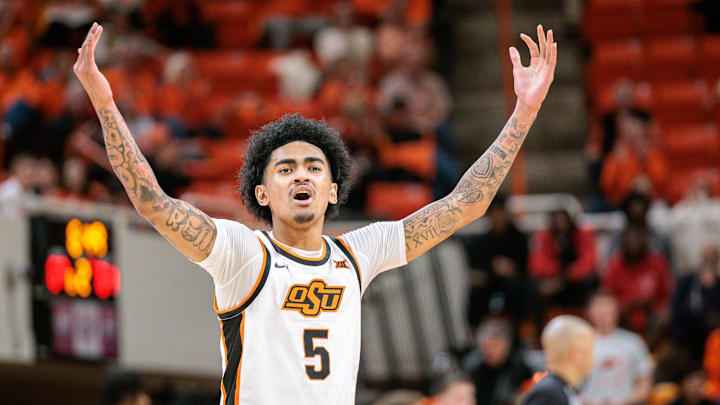 Jan 6, 2026; Stillwater, Oklahoma, USA; Oklahoma State Cowboys guard Vyctorius Miller (5) reacts after a play during the second half against the UCF Knights at Gallagher-Iba Arena. Mandatory Credit: William Purnell-Imagn Images