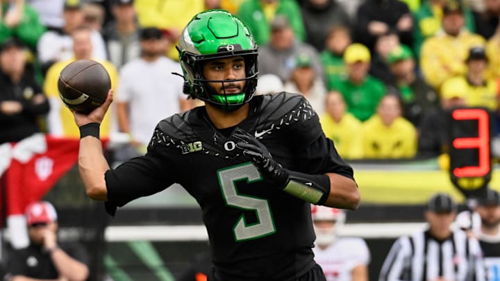 Oct 11, 2025; Eugene, Oregon, USA; Oregon Ducks quarterback Dante Moore (5) throws a pass against the Indiana Hoosiers during the first quarter at Autzen Stadium. Mandatory Credit: Troy Wayrynen-Imagn Images