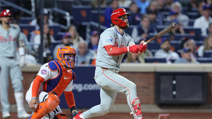 Oct 9, 2024; New York, New York, USA; Philadelphia Phillies first baseman Bryce Harper (3) hits a double in the sixth inning against the New York Mets in game four of the NLDS for the 2024 MLB Playoffs at Citi Field. Oct 9, 2024; New York, New York, USA; Philadelphia Phillies first baseman Bryce Harper (3) hits a double in the sixth inning against the New York Mets in game four of the NLDS for the 2024 MLB Playoffs at Citi Field.