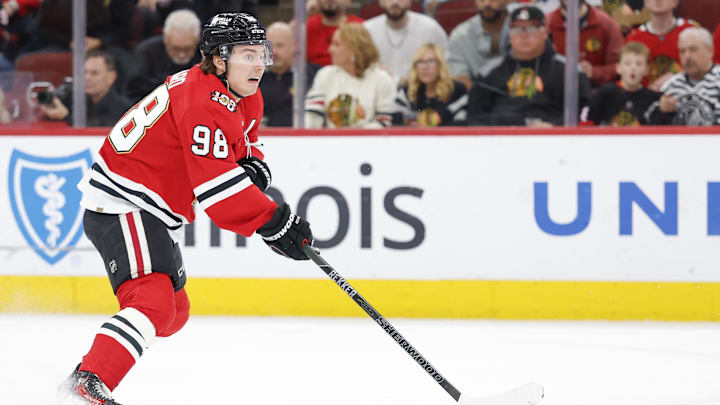 Apr 13, 2026; Chicago, Illinois, USA; Chicago Blackhawks center Connor Bedard (98) looks to pass the puck against the Buffalo Sabres during the first period at United Center. Mandatory Credit: Kamil Krzaczynski-Imagn Images