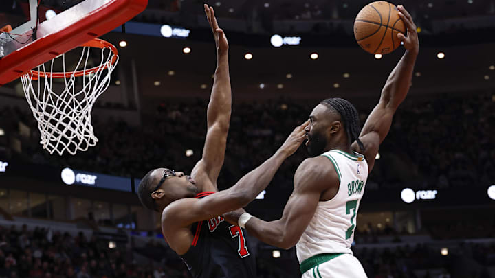 Nov 29, 2024; Chicago, Illinois, USA; Boston Celtics guard Jaylen Brown (7) goes up for a dunk against the Chicago Bulls forward Jalen Smith (7) during the second half at United Center. Mandatory Credit: Kamil Krzaczynski-Imagn Images