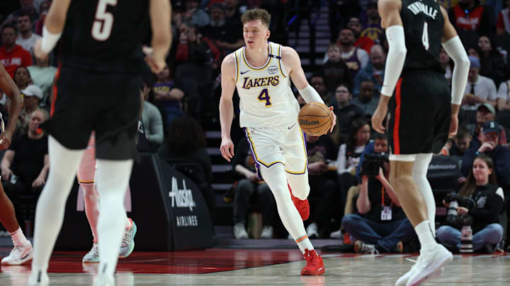 Apr 13, 2025; Portland, Oregon, USA; Los Angeles Lakers guard Dalton Knecht (4) brings the ball up the court against the Portland Trail Blazers in the second half at Moda Center. Apr 13, 2025; Portland, Oregon, USA; Los Angeles Lakers guard Dalton Knecht (4) brings the ball up the court against the Portland Trail Blazers in the second half at Moda Center.