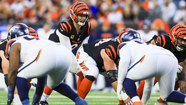 Dec 28, 2024; Cincinnati, Ohio, USA; Cincinnati Bengals quarterback Joe Burrow (9) snaps the ball against the Denver Broncos in the first half at Paycor Stadium. 