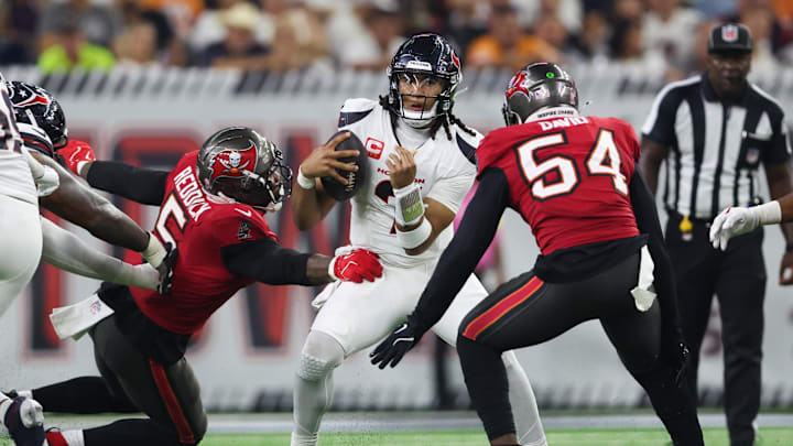 Sep 15, 2025; Houston, Texas, USA; Houston Texans quarterback C.J. Stroud (7) comes under pressure from Tampa Bay Buccaneers linebacker Lavonte David (54) and Tampa Bay Buccaneers linebacker Haason Reddick (5) during the third quarter at NRG Stadium. Mandatory Credit: Troy Taormina-Imagn Images